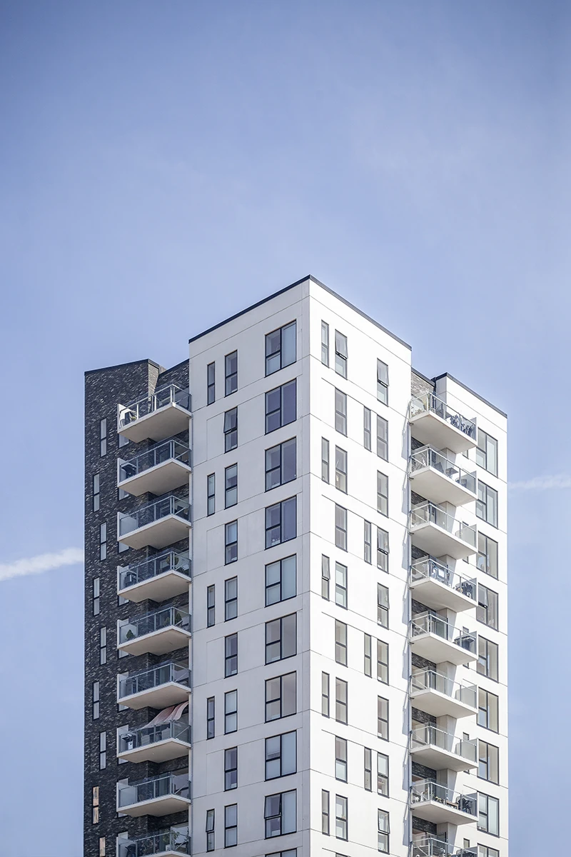 vertical-shot-white-building-clear-sky